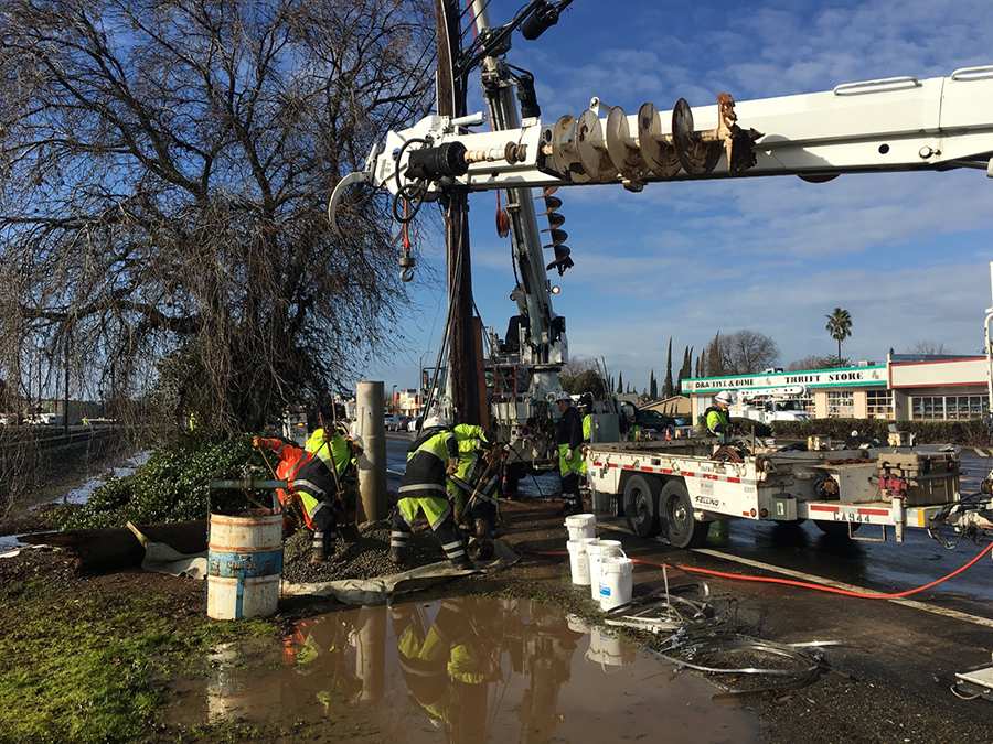 Emergency crew drilling street